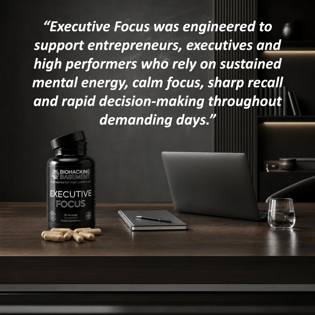 Executive Focus supplement bottle displayed on a dark wooden desk alongside loose capsules, a closed laptop, a notebook, and a glass, with a large quote overlaid at the top against a dark office background.